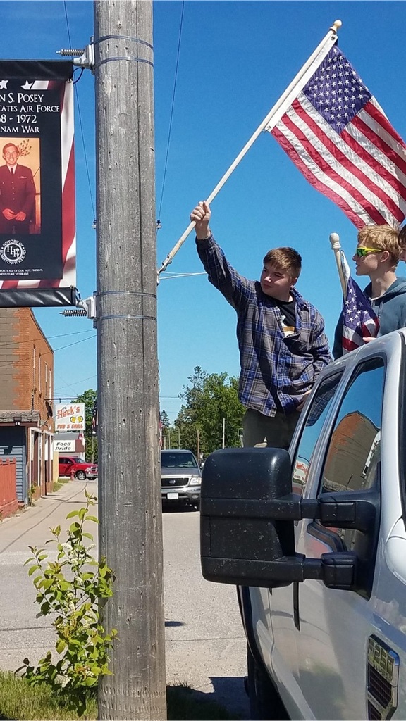 Boy Scouts putting flags up